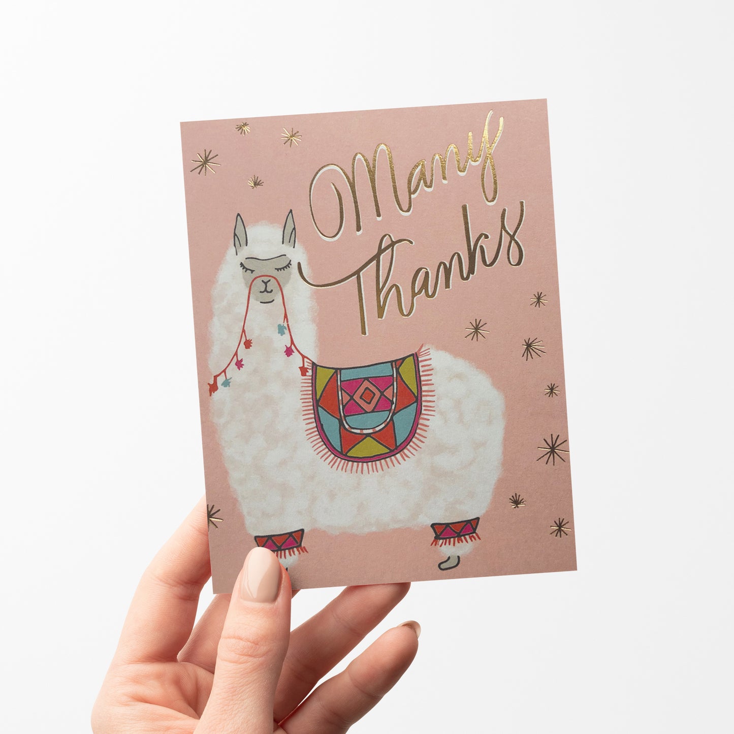 Thank you card featuring a cute alpaca illustration with a colorful blanket and "many Thanks" in gold foil.
