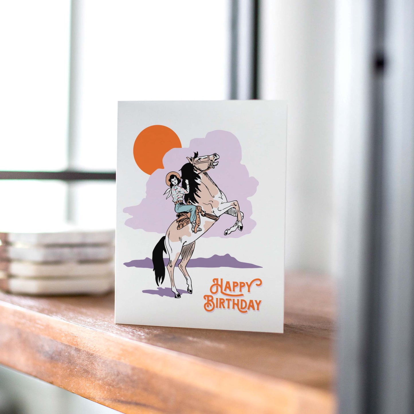 Charming birthday card highlighting a cowgirl on her horse, designed to celebrate a cowgirl's special day.