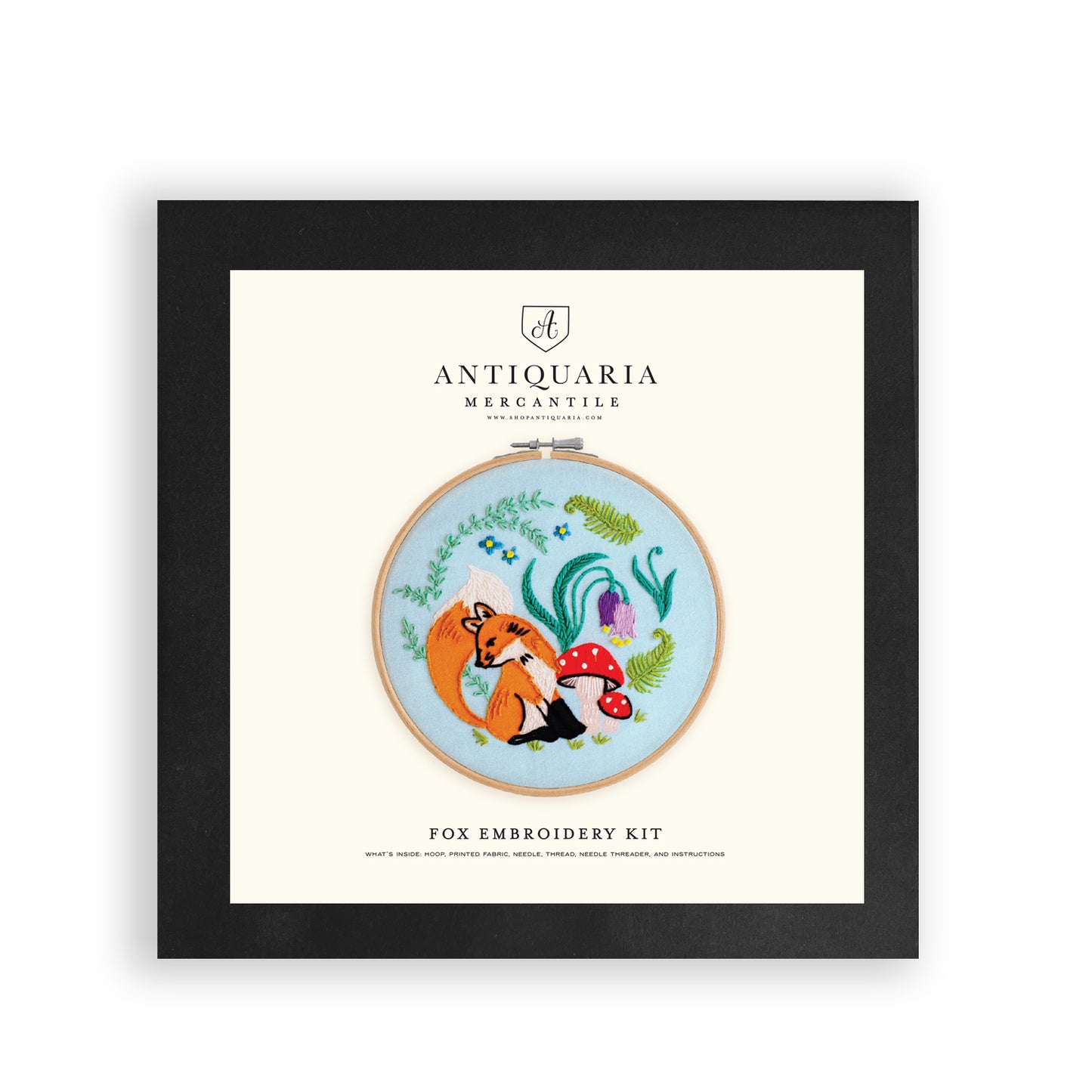 Embroidery kit with fabric, wooden hoop, thread, needle, and instructions for beginners, featuring cute fox surrounded by different flora and fauna