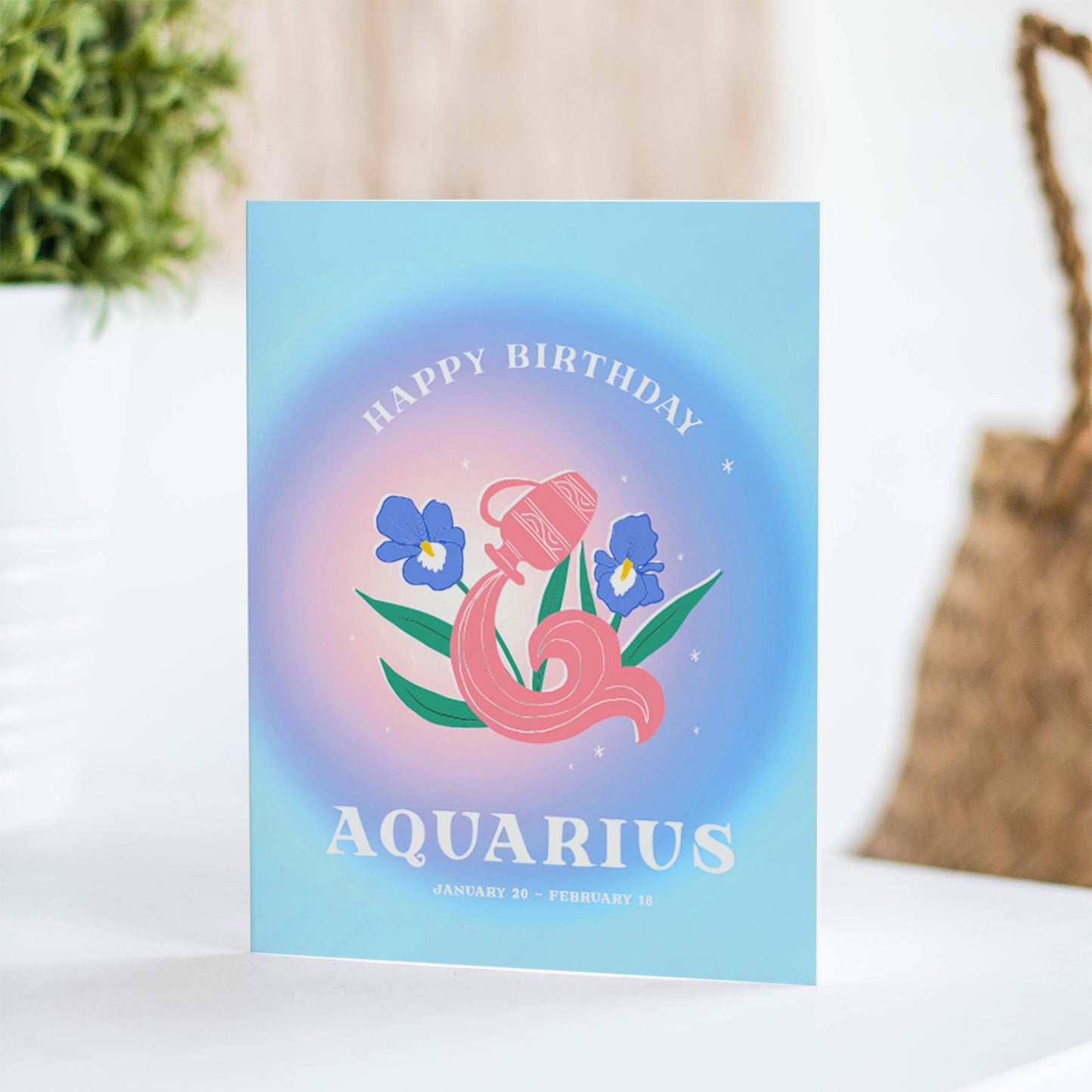 Modern birthday card featuring the Aquarius symbol with abstract water motifs and electric colors, celebrating Aquarius's innovative and humanitarian spirit.