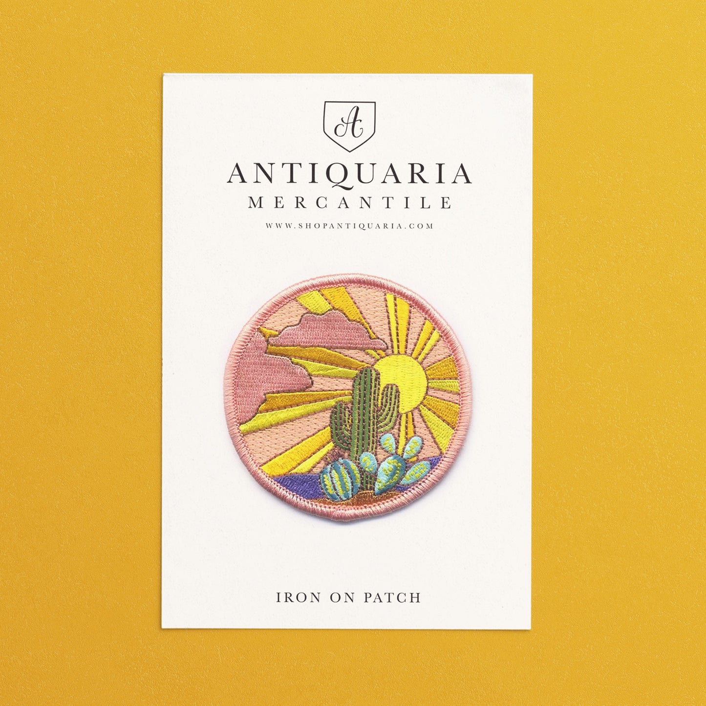 Vibrant Cactus Sunset embroidered iron-on patch showcasing a desert landscape with a colorful sunset, perfect for decorating jackets, bags, or hats.