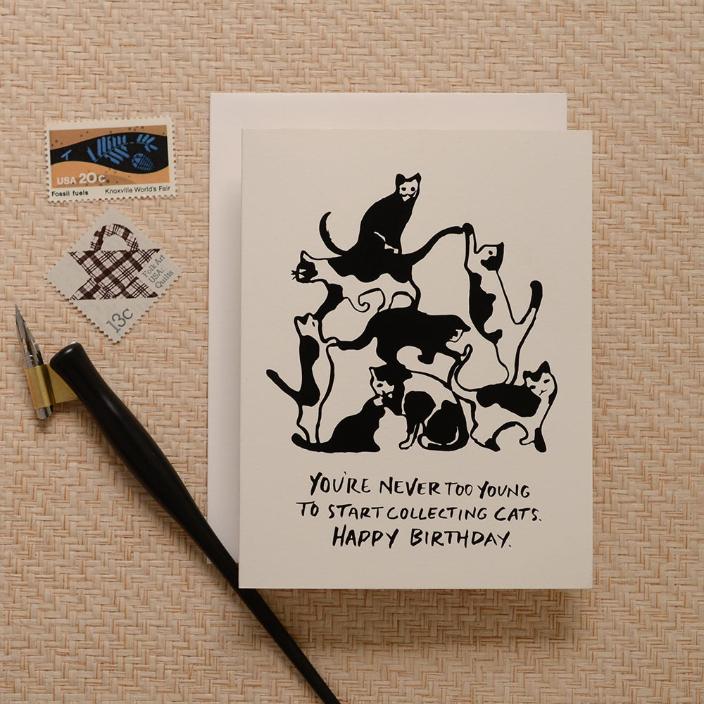 Fun and whimsical birthday card showcasing a cat tower filled with playful cats, designed for cat lovers celebrating their special day.