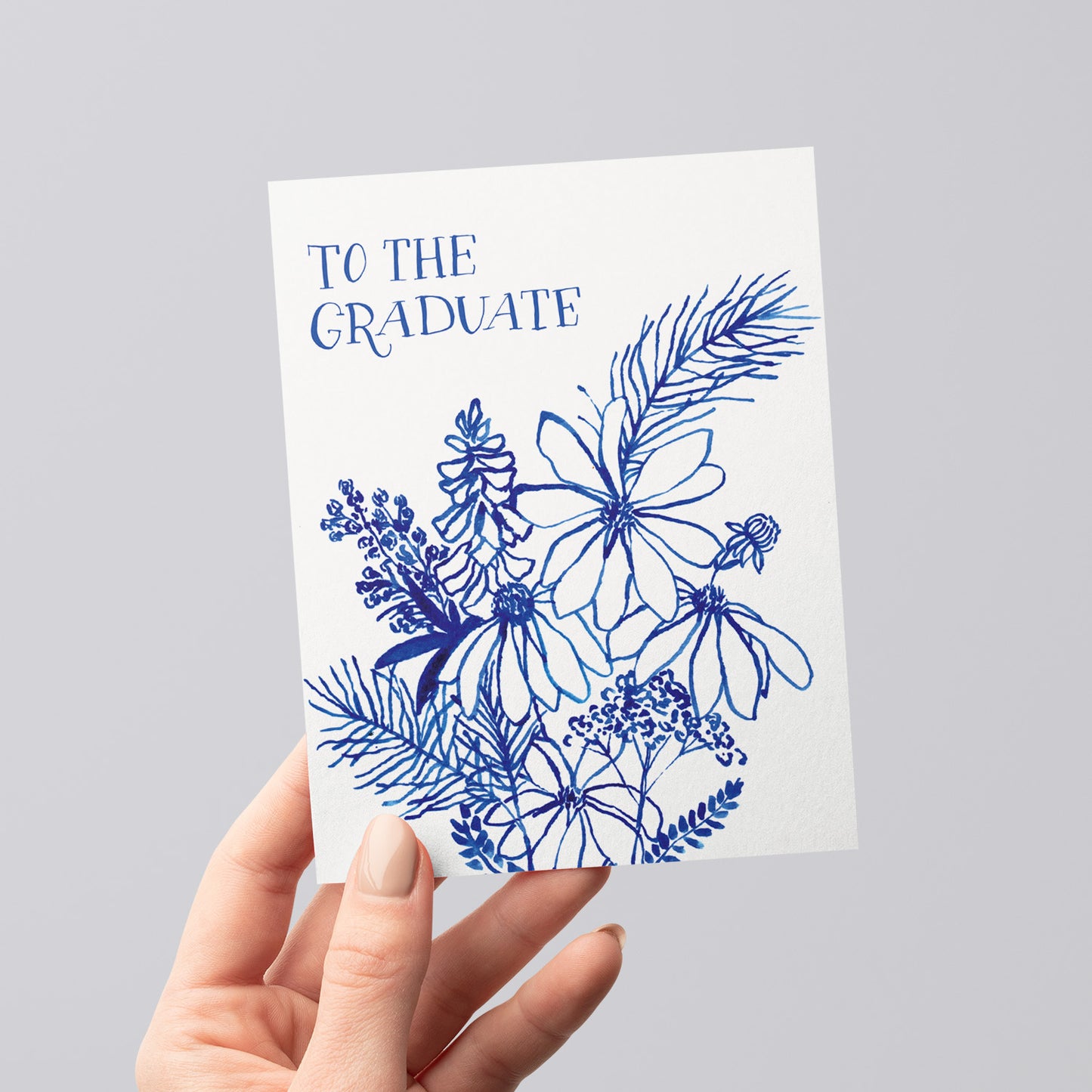 Indigo Wildflowers Graduate card with a botanical design, perfect for congratulating graduates