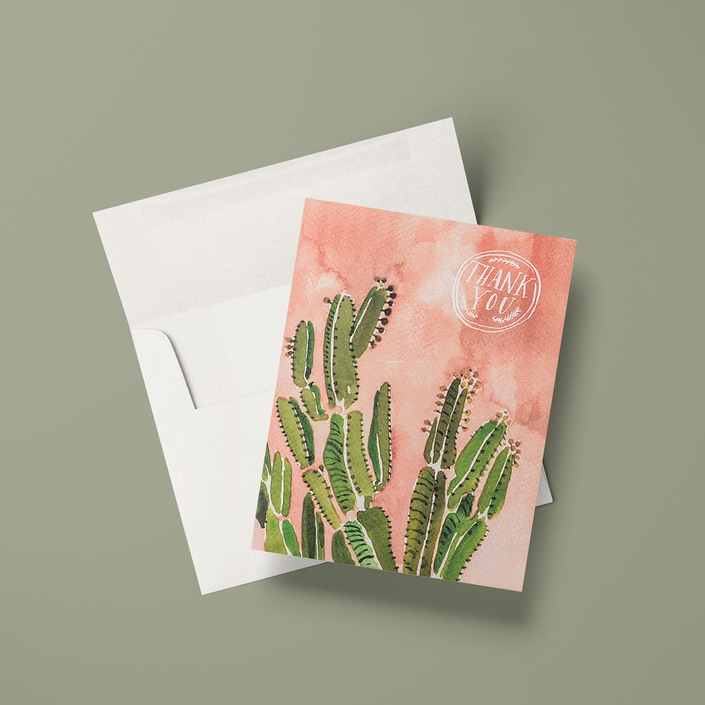 Thank you card featuring a coral-colored background and beautiful watercolor cactus illustration with warm desert tones.