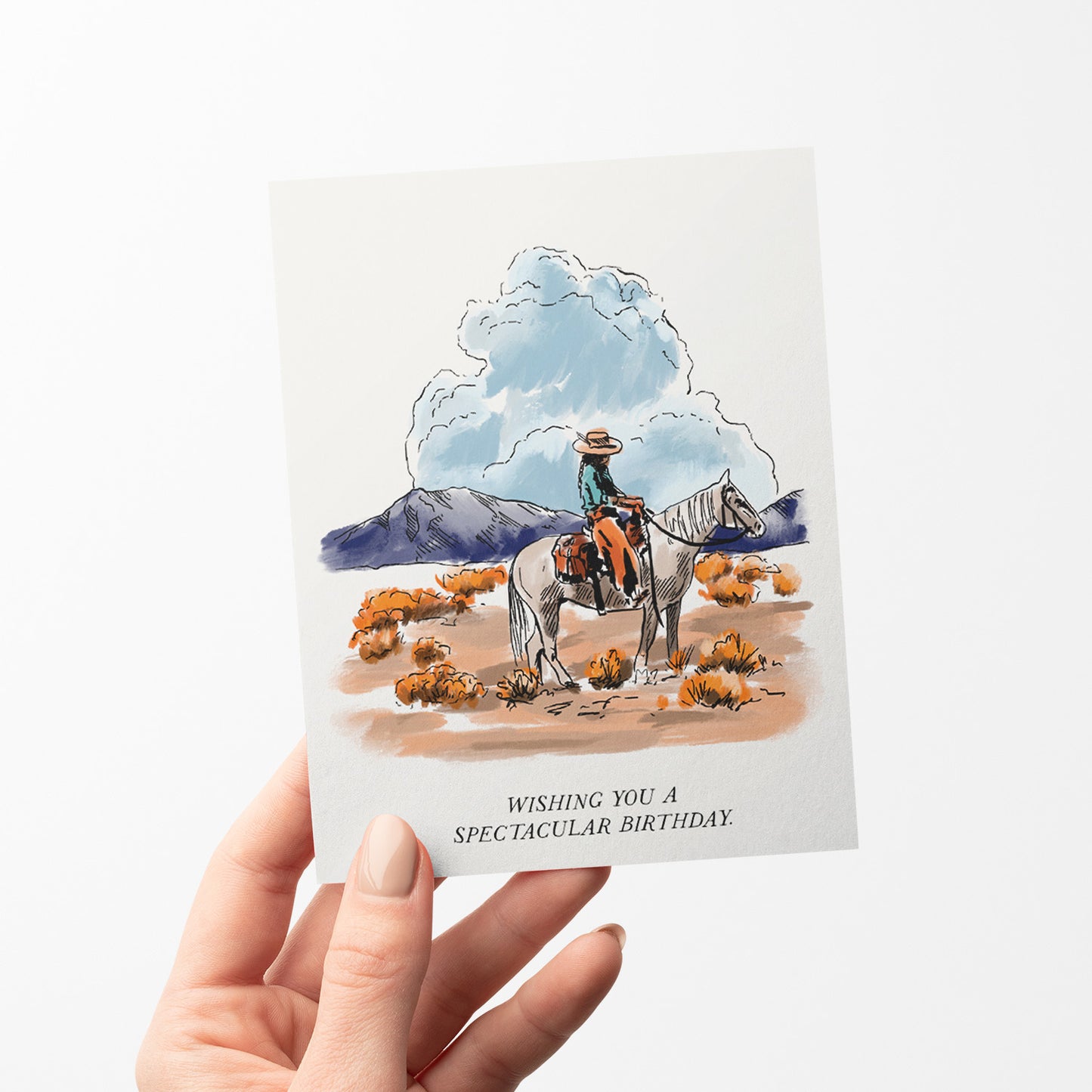 Rustic birthday card depicting expansive high plains with rolling hills and wide-open skies, and a cowboy on his horse, capturing the essence of the great outdoors.