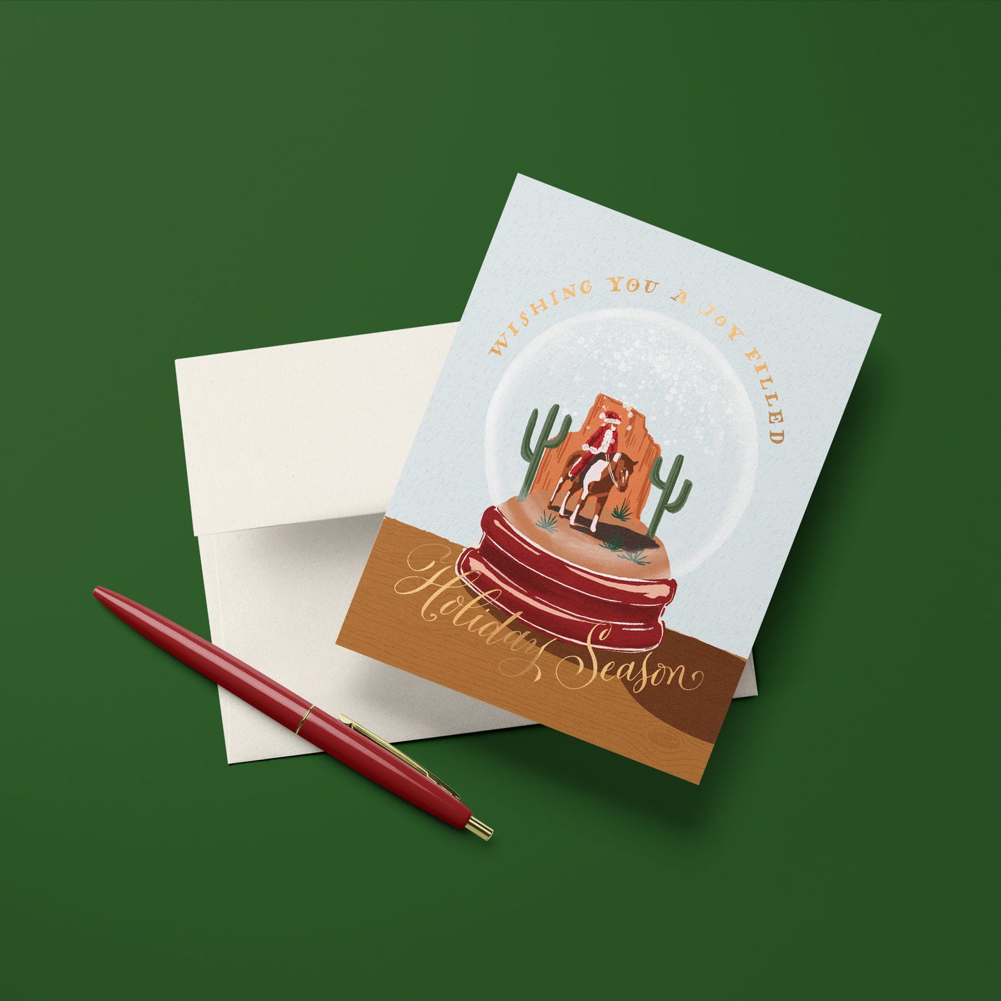 Cowboy Santa snowglobe holiday card, with a whimsical cowboy Santa inside a snowglobe, perfect for holiday fun, blank inside.