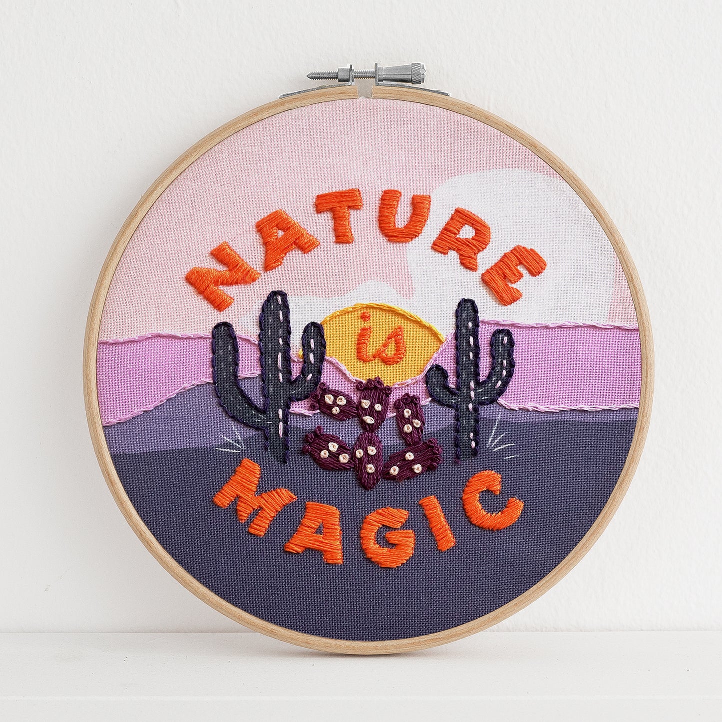Embroidery kit with fabric, wooden hoop, thread, needle, and instructions for beginners, featuring cute fox surrounded by different flora and fauna