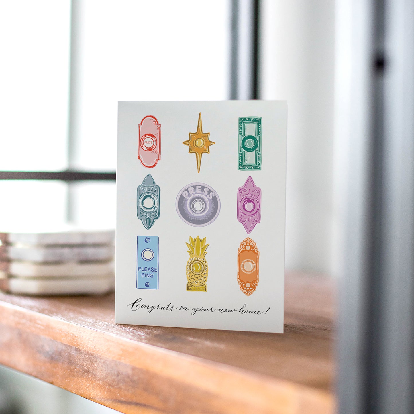 Doorbells Housewarming card with vibrant doorbell illustrations, a unique card for new homeowners