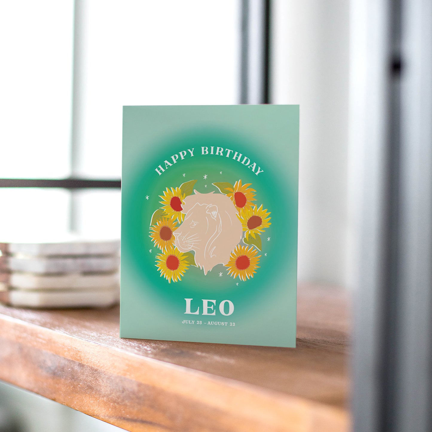 Bold birthday card showcasing the Leo symbol with radiant greens and a lion motif, reflecting the confidence and charisma of Leo.