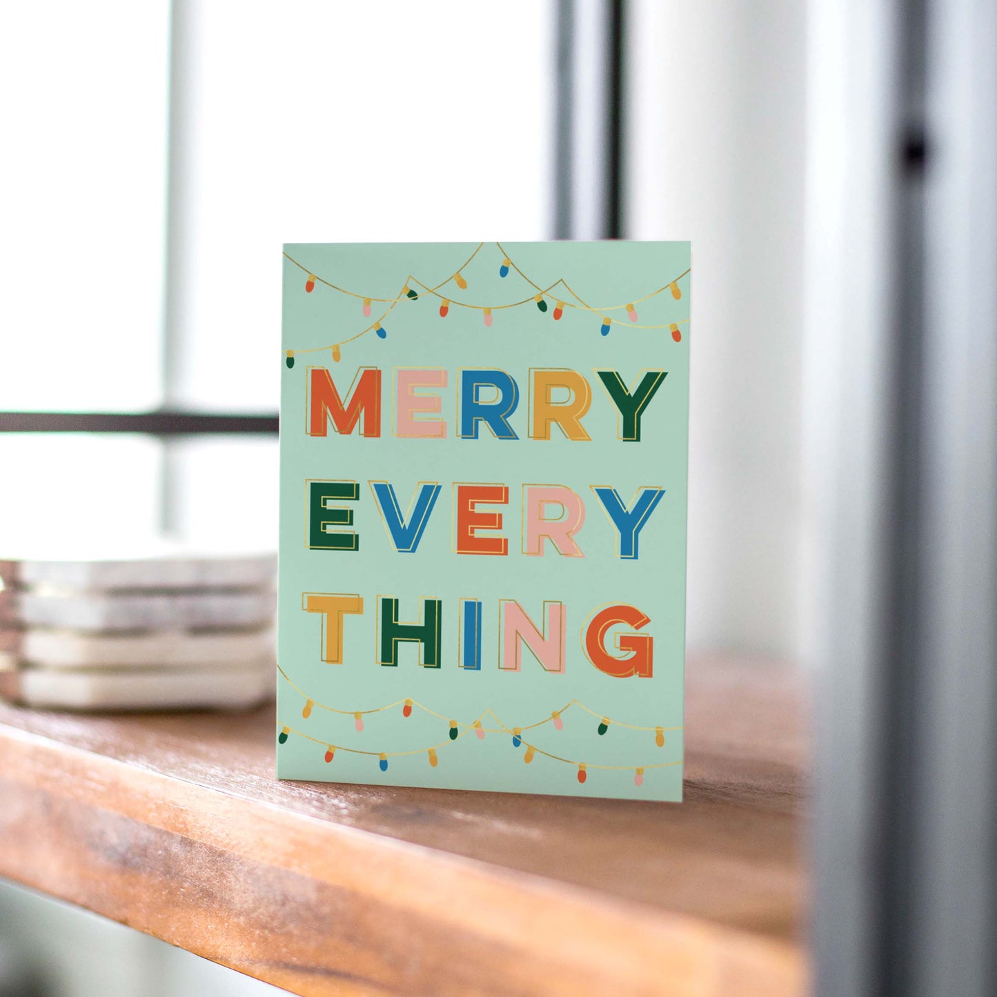 Mint Merry Everything holiday card with mint green designs and hanging Christmas lights, perfect for a fresh and festive holiday greeting, blank inside.