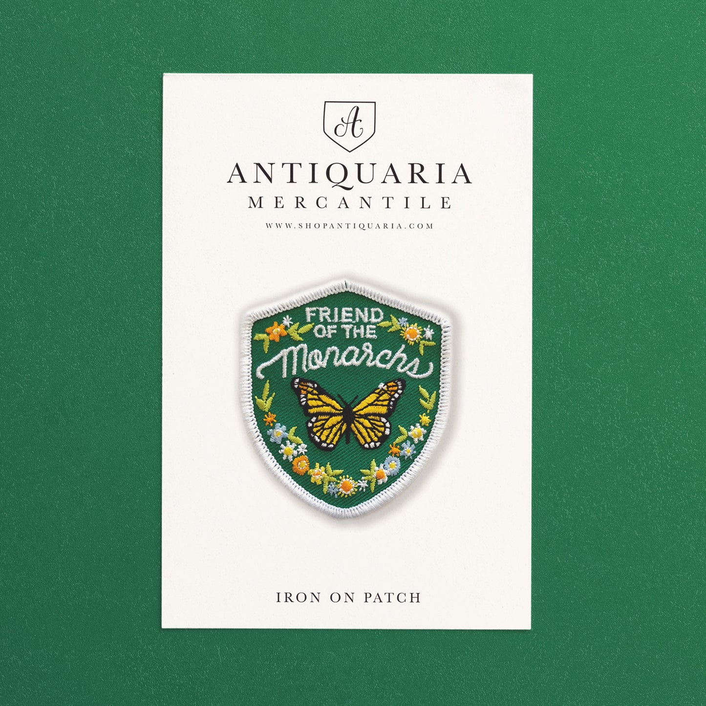 Colorful monarch featuring floral design embroidered iron-on patch with detailed petals, perfect for jackets, bags, or hats.