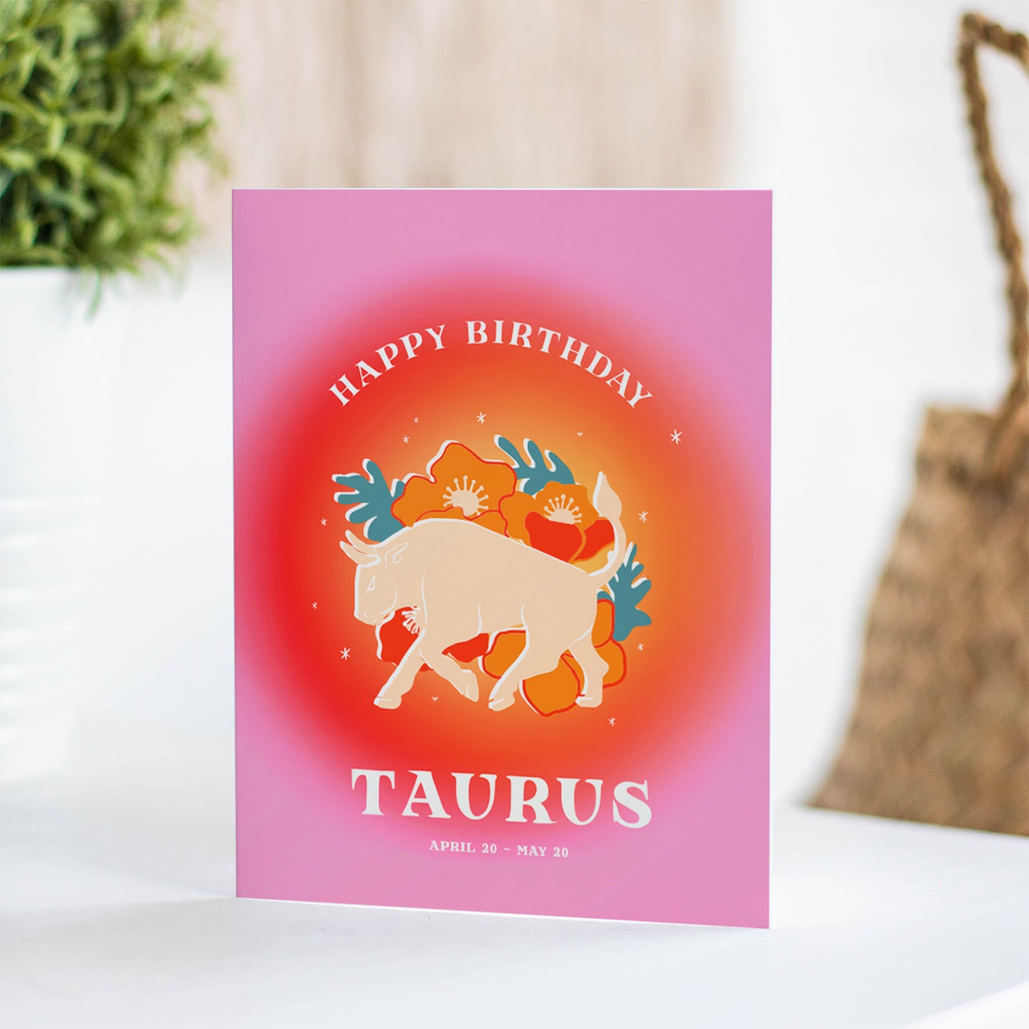 Elegant birthday card showcasing the Taurus symbol with bright reds and the taurus bull, embodying the grounded and nurturing qualities of Taurus.