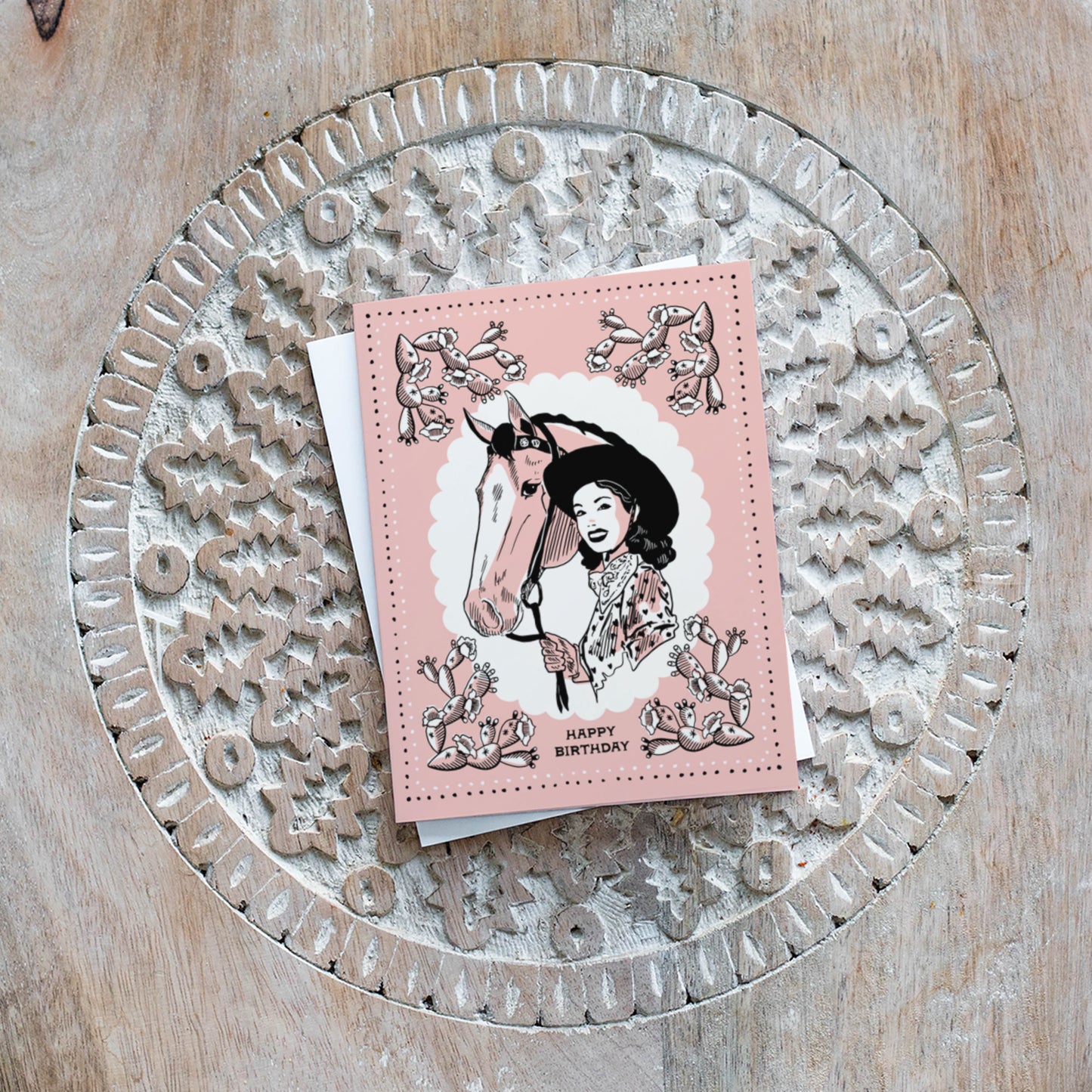 Charming birthday card with vintage cowgirl imagery, featuring classic western attire and a rustic feel for a nostalgic celebration.