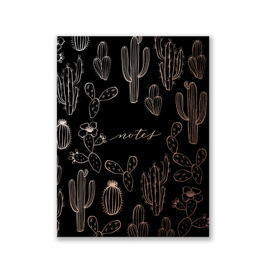 Black softcover staple-bound notebook with a cactus pattern in gold accents.