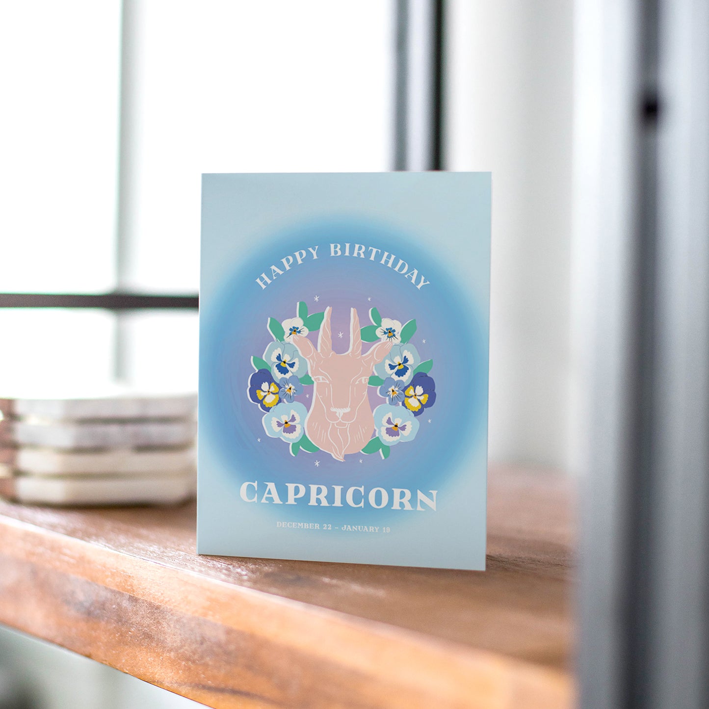 Elegant birthday card showcasing the Capricorn symbol with a goat illustration, reflecting Capricorn's ambition and resilience.