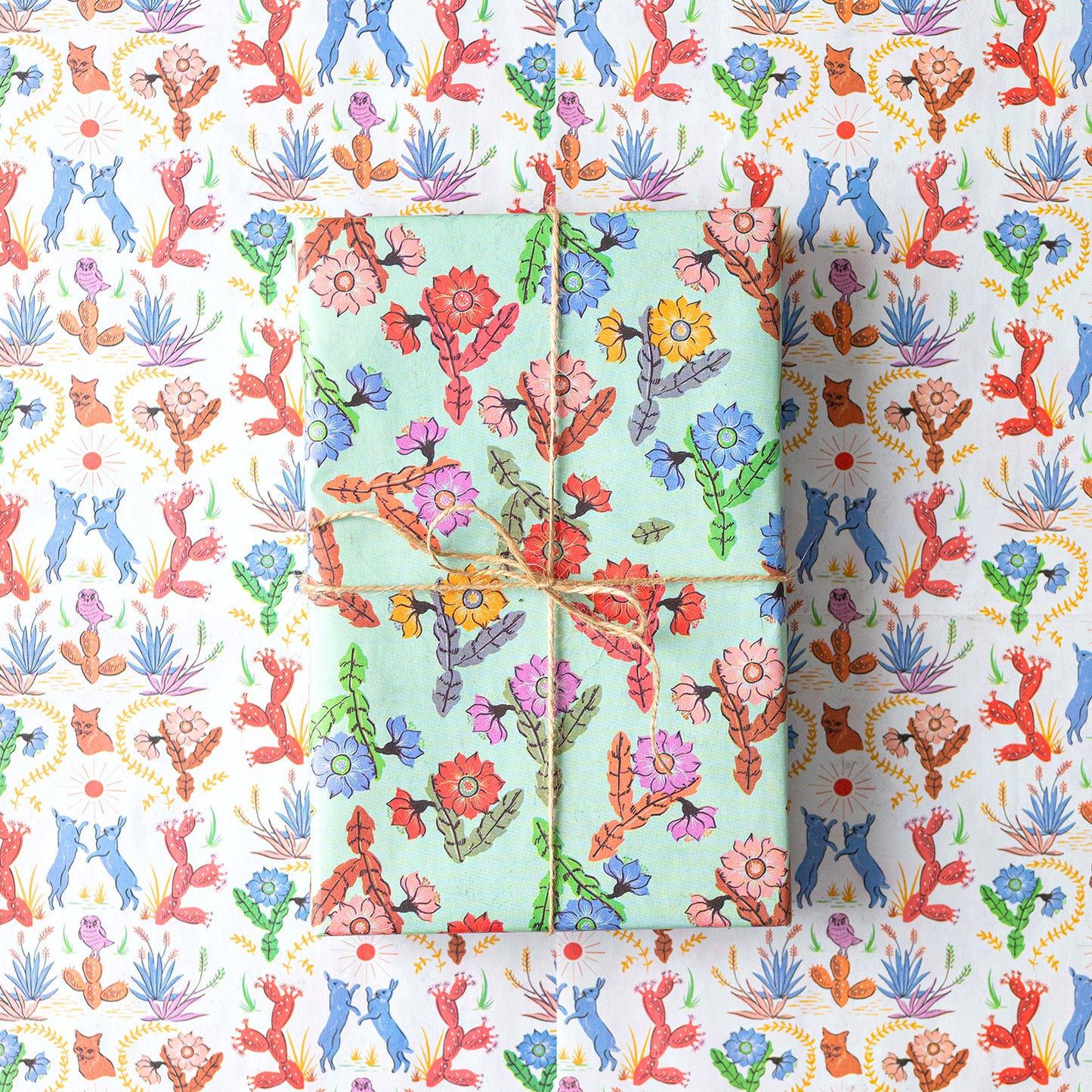 Eco-friendly double-sided gift wrap featuring vibrant desert flora designs on both sides one hundred percent recyclable and compostable.