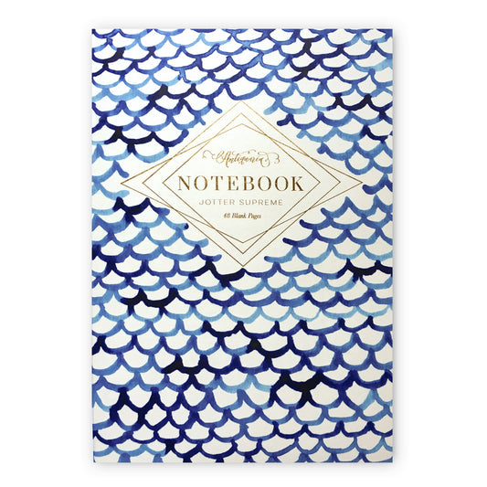 Blue and white softcover staple-bound notebook featuring a fish scale design. Blank interior pages. 