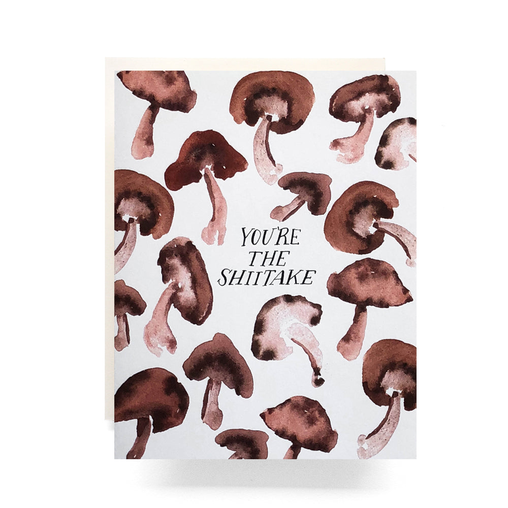 Playful thank you card with an watercolor mushrooms and the phrase 'You're the Shiitake!' A fun and quirky way to show appreciation.