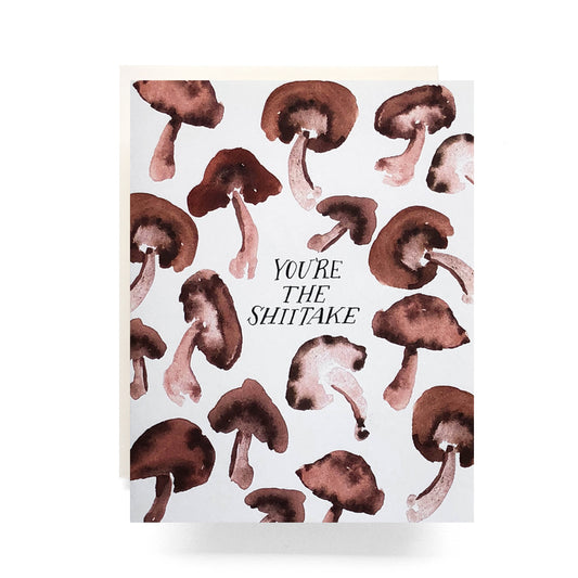 Playful thank you card with an watercolor mushrooms and the phrase 'You're the Shiitake!' A fun and quirky way to show appreciation.