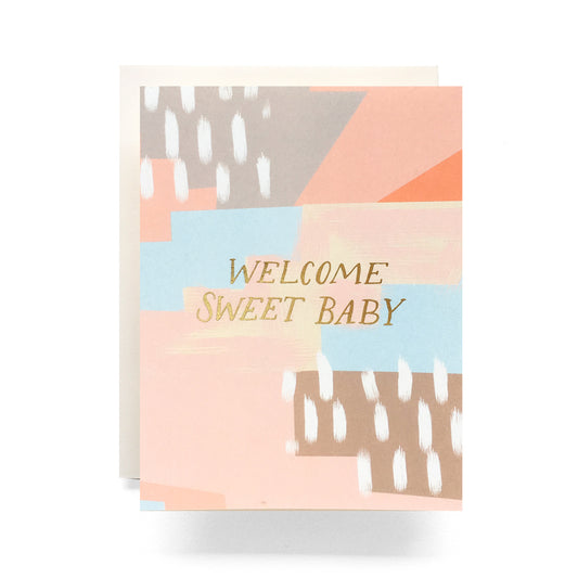 Abstract pink and blue design with gold foil text 'Welcome Sweet Baby' on a blank card.