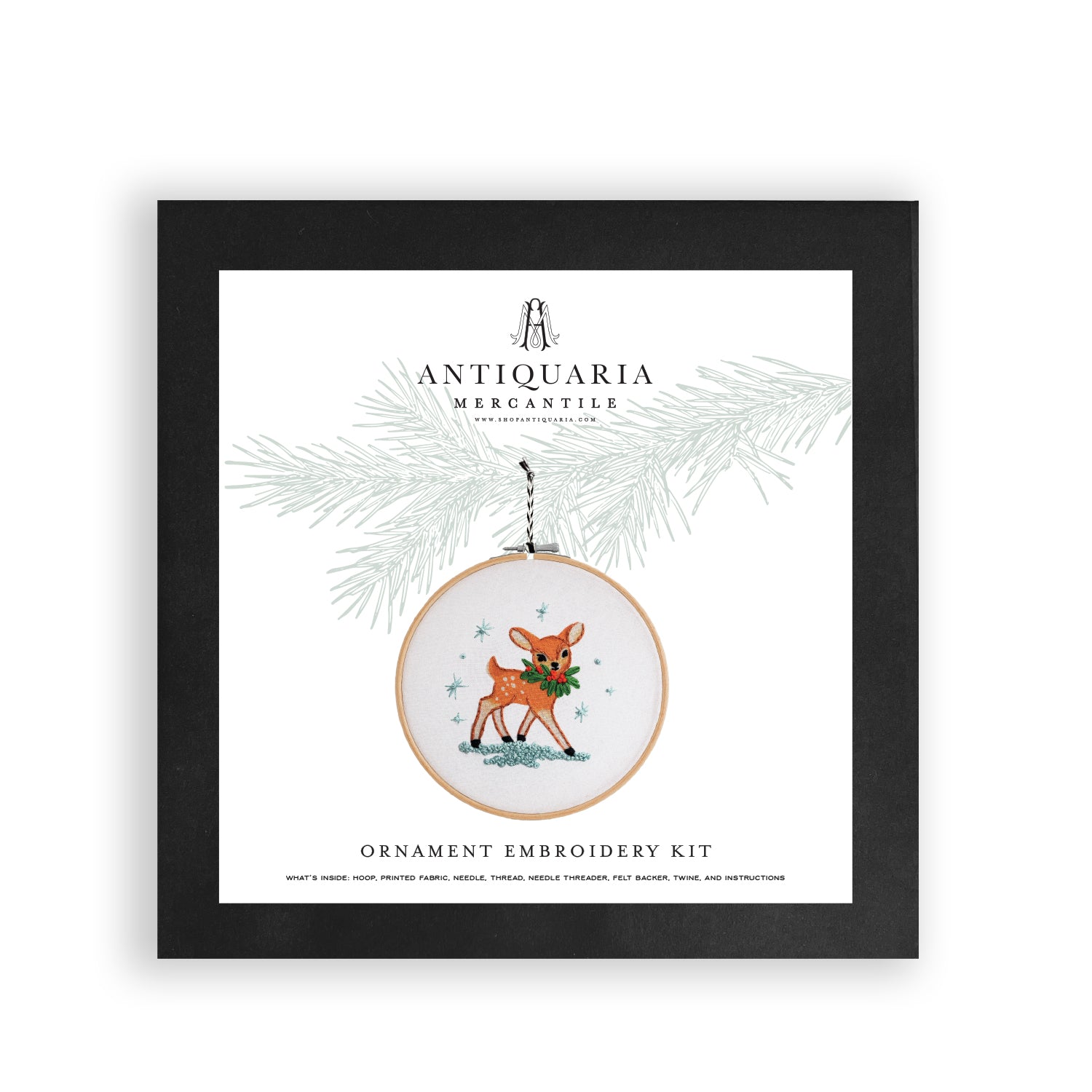 Antiquaria Mercantile ornament embroidery kit packaging with a deer design on a white background.
