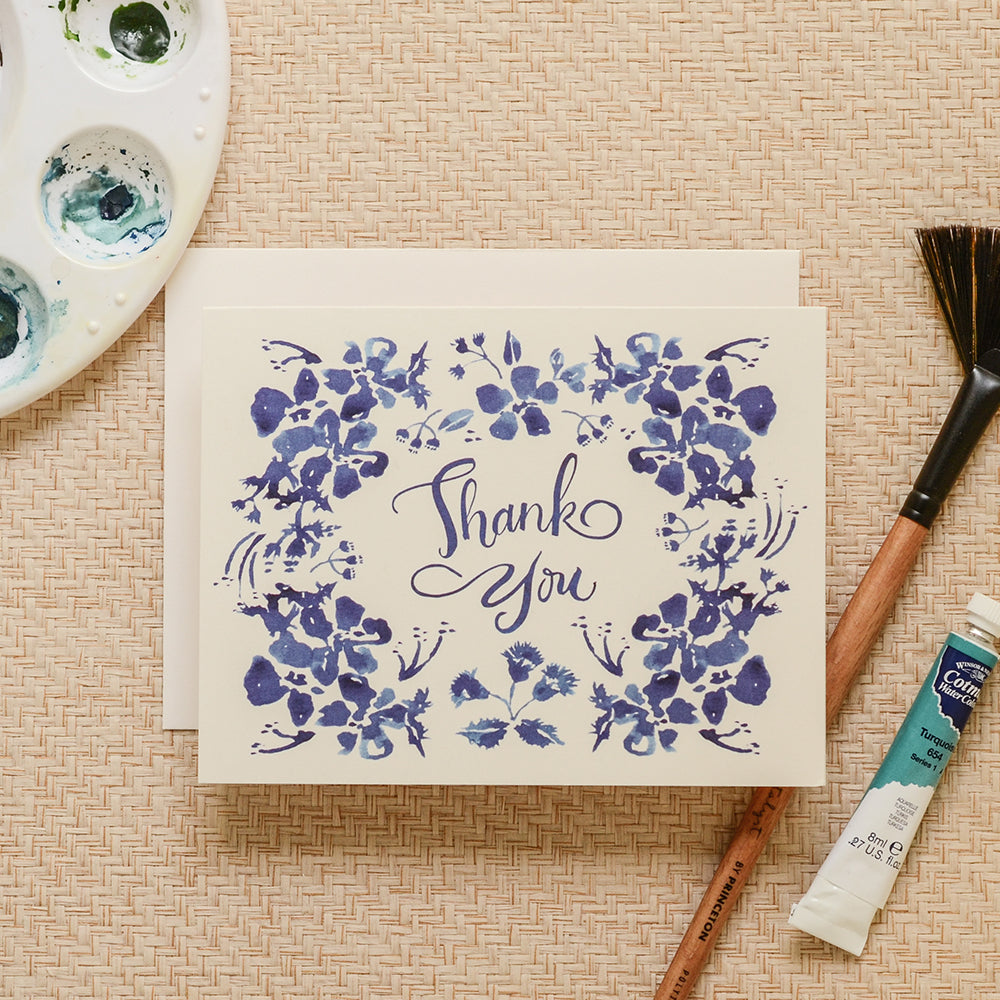 Thank you card with a charming watercolor illustrations of blue wildflowers and a vintage-style font