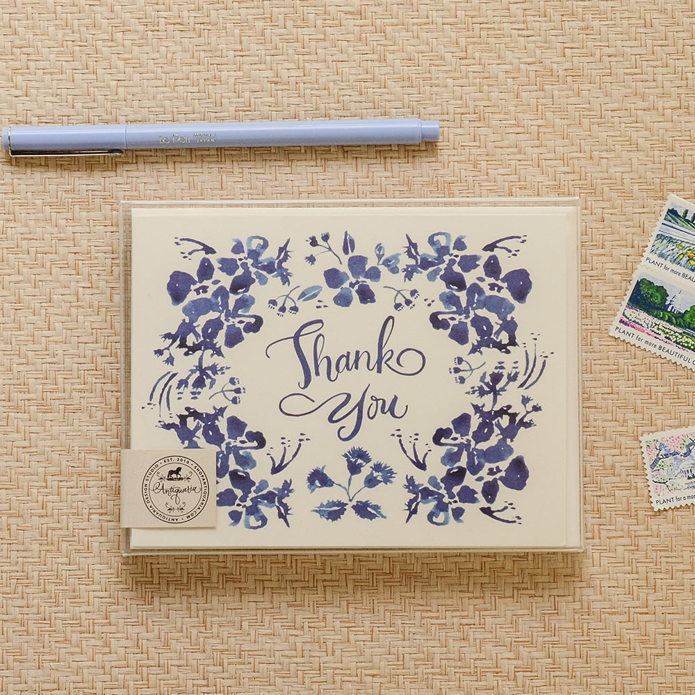 Thank you card with a charming watercolor illustrations of blue wildflowers and a vintage-style font