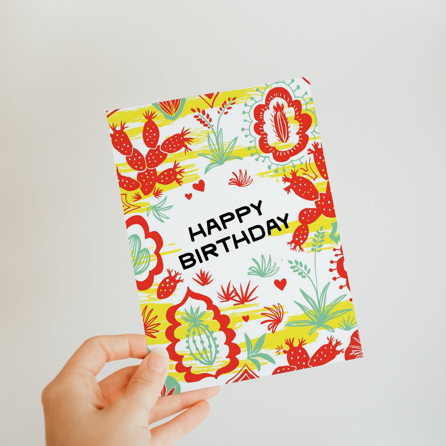 Festive birthday card with bold colors, cacti illustrations in a pattern, celebrating the excitement of a birthday fiesta.