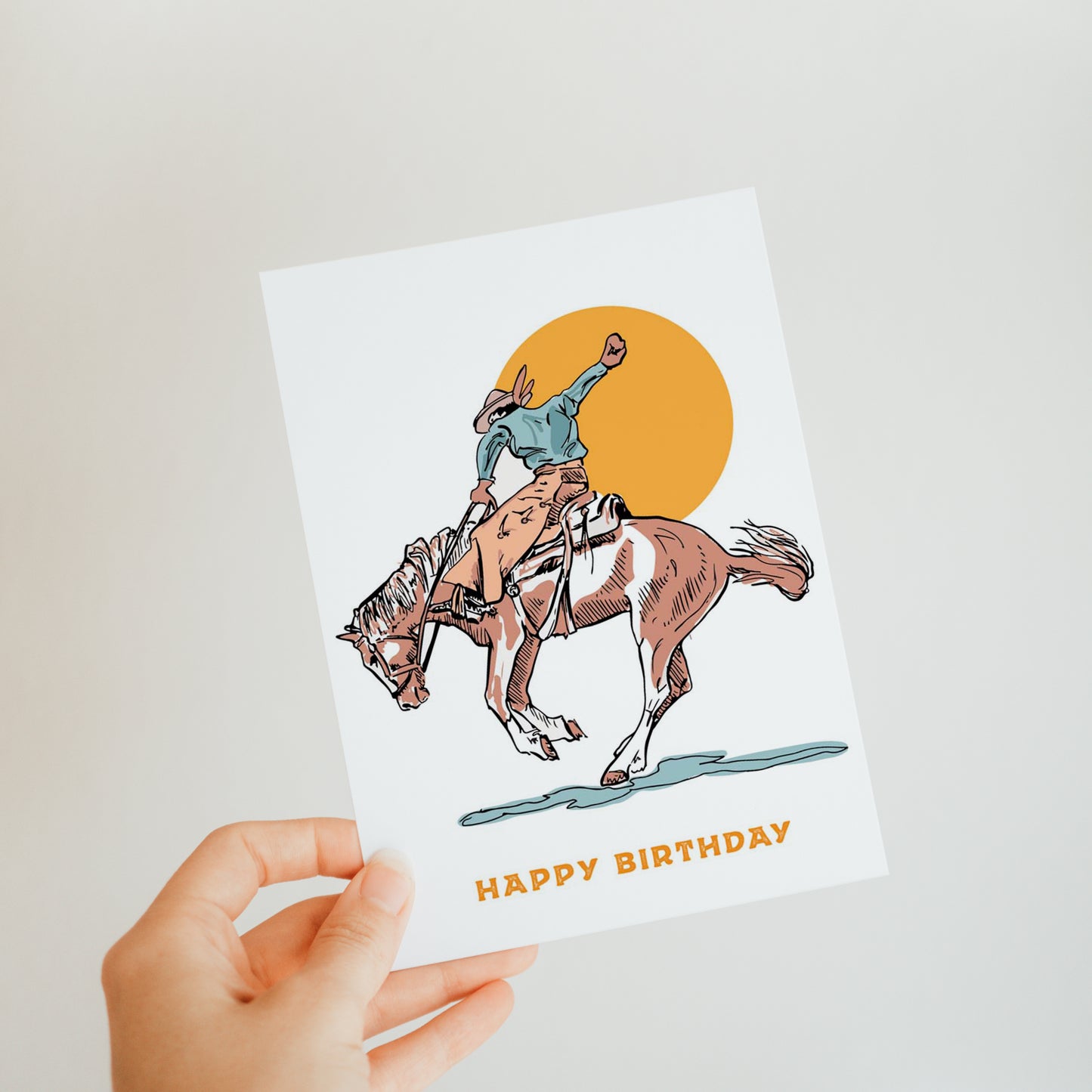 Classic birthday card featuring traditional cowboy on a bucking bronco, perfect for celebrating a cowboy's special day.