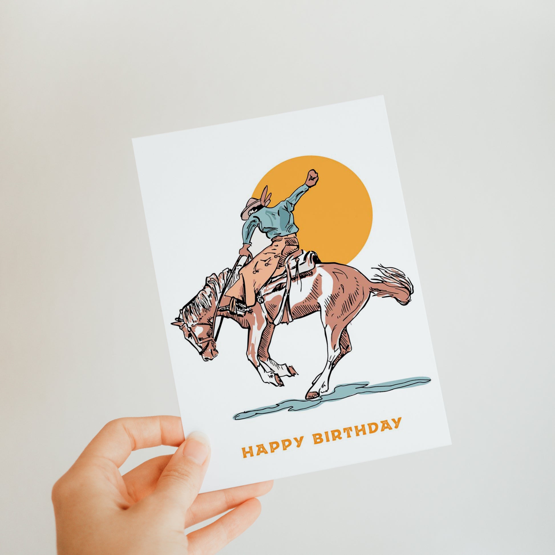 Classic birthday card featuring traditional cowboy on a bucking bronco, perfect for celebrating a cowboy's special day.