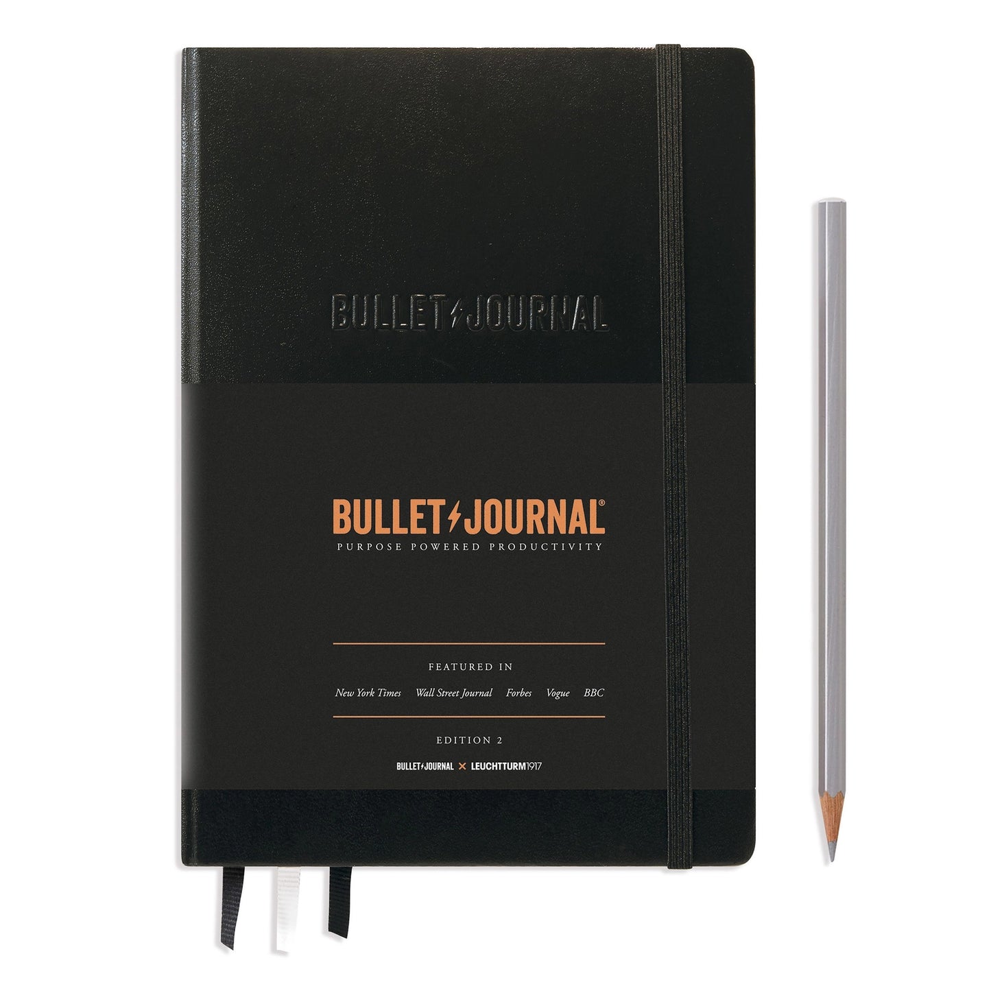 Hardcover dot grid notebook in classic black, ideal for bullet journaling and creative sketching.