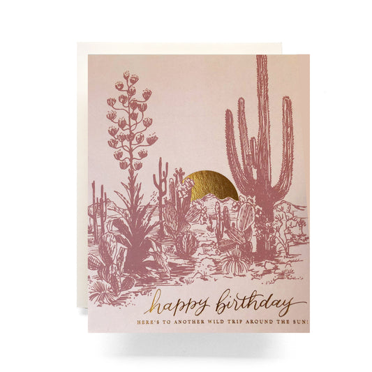 Stunning birthday card featuring a desert sunset backdrop with silhouetted desert landscape, creating a warm and tranquil atmosphere for birthday wishes.