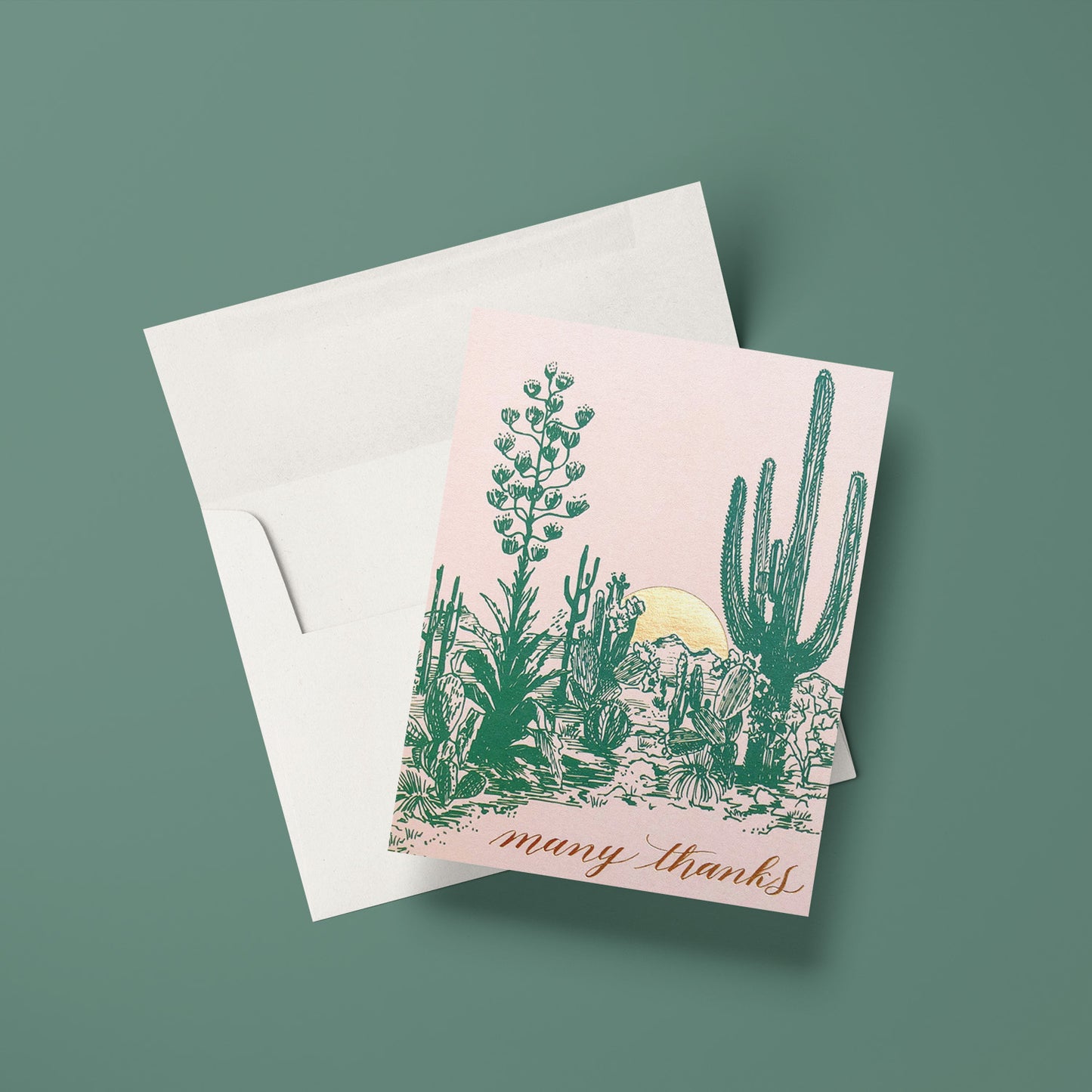 Thank you card with a sunset over a cactus landscape, creating a warm, desert scene with many thanks written in a classic script