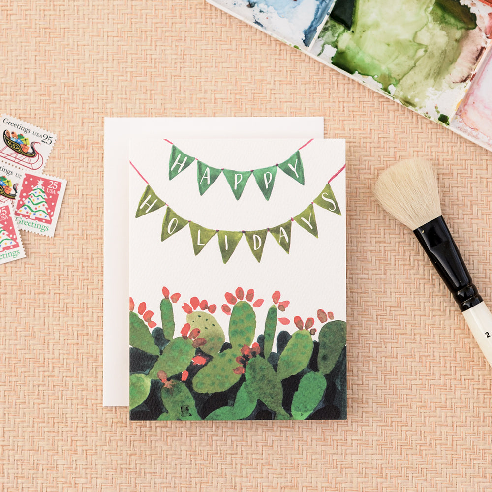 Cactus pennant holiday card, featuring a festive cacti with a holiday pennant, perfect for holiday cheer, blank inside.