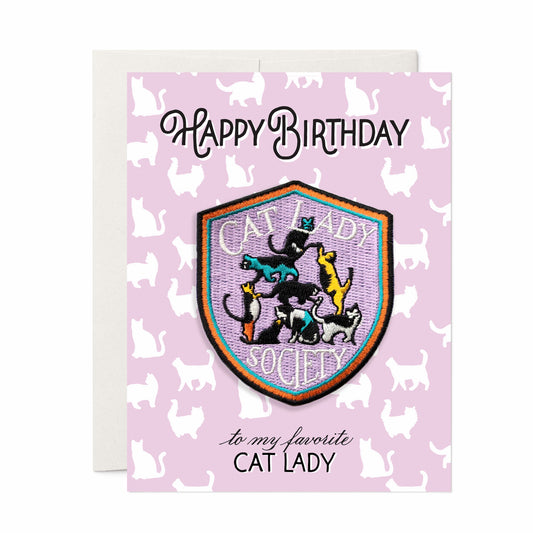 Playful birthday card with an iron-on 'Cat Lady' patch, adorned with cat illustrations, ideal for feline enthusiasts celebrating their special day.