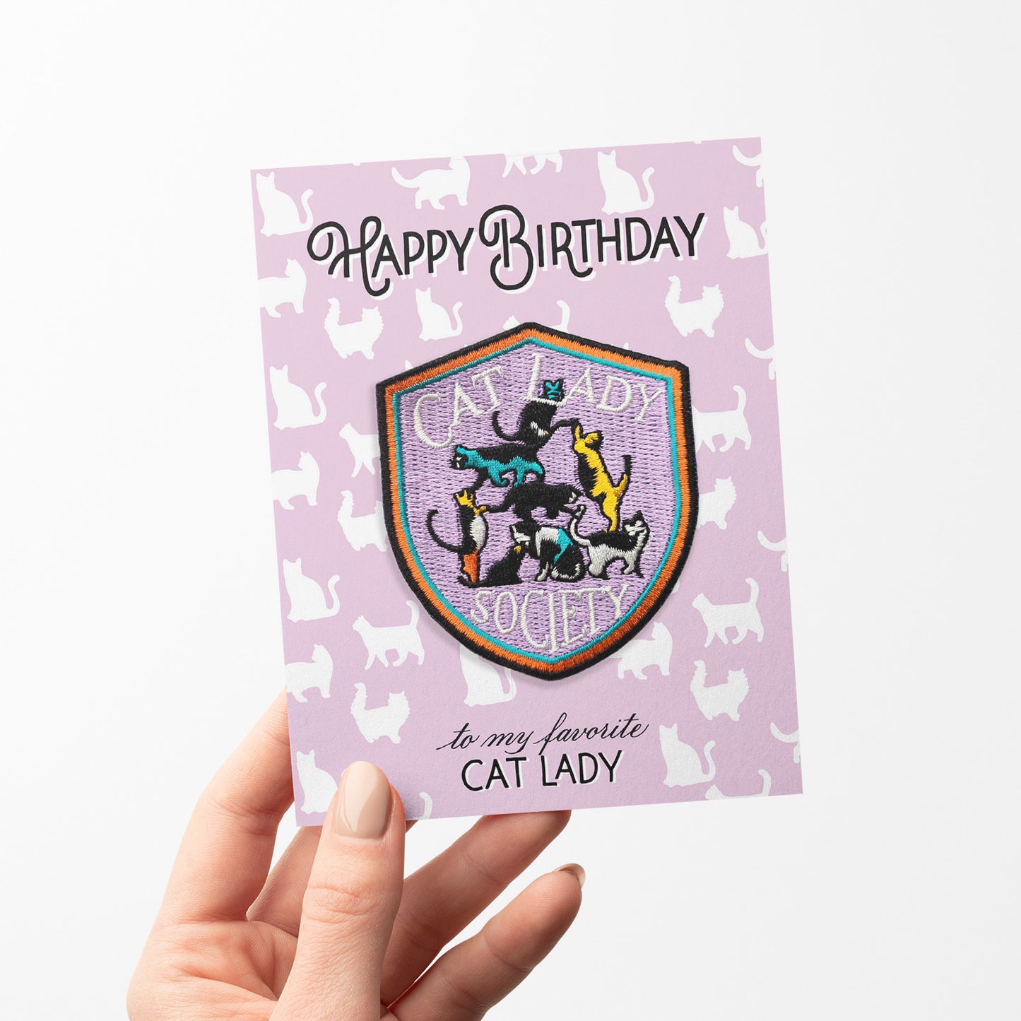 Playful birthday card with an iron-on 'Cat Lady' patch, adorned with cat illustrations, ideal for feline enthusiasts celebrating their special day.