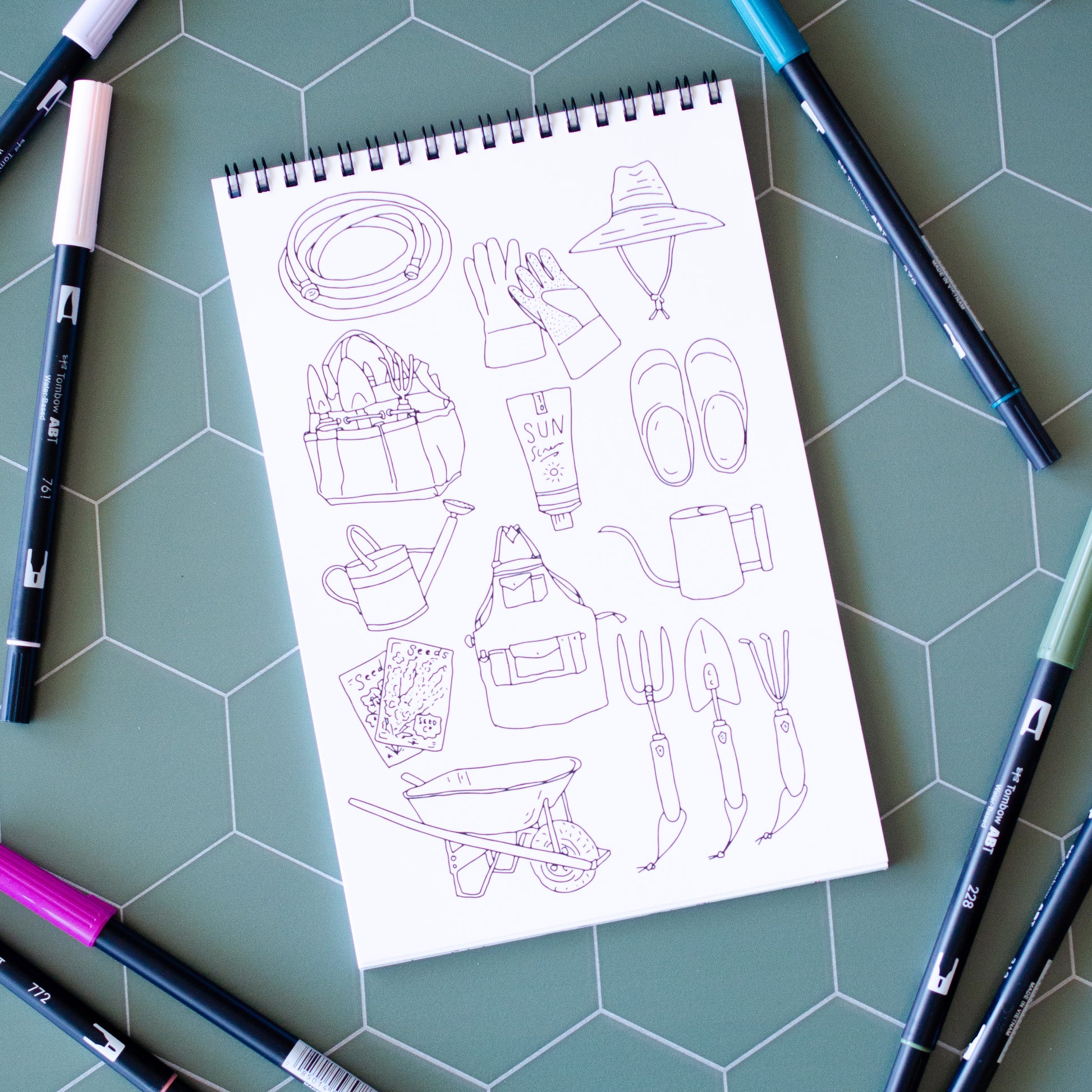 Cottage Garden Coloring Book with 22 pages of hand-drawn illustrations featuring flowers, bees, butterflies, and a whimsical garden gnome. Spiral-bound adult coloring book with intricate botanical designs, perfect for relaxation and creativity.