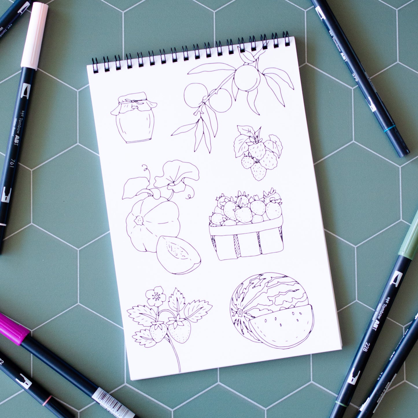 Cottage Garden Coloring Book with 22 pages of hand-drawn illustrations featuring flowers, bees, butterflies, and a whimsical garden gnome. Spiral-bound adult coloring book with intricate botanical designs, perfect for relaxation and creativity.