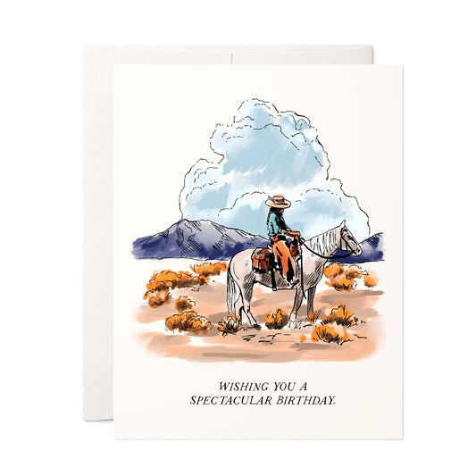 Rustic birthday card depicting expansive high plains with rolling hills and wide-open skies, and a cowboy on his horse, capturing the essence of the great outdoors.