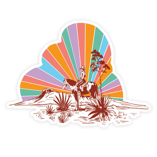 Sticker of a cowgirl riding a horse in the desert with colorful rainbow sunset rays in the background.