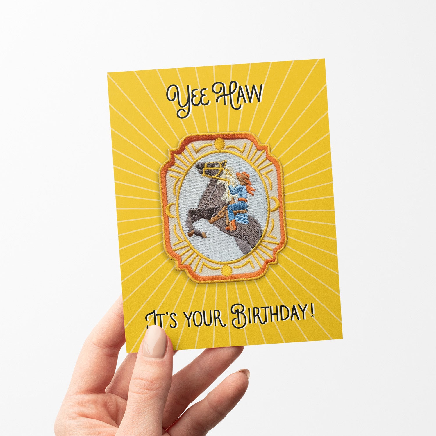 Charming birthday card featuring an iron-on cowgirl patch with Western motifs, perfect for those with a love for the wild west.