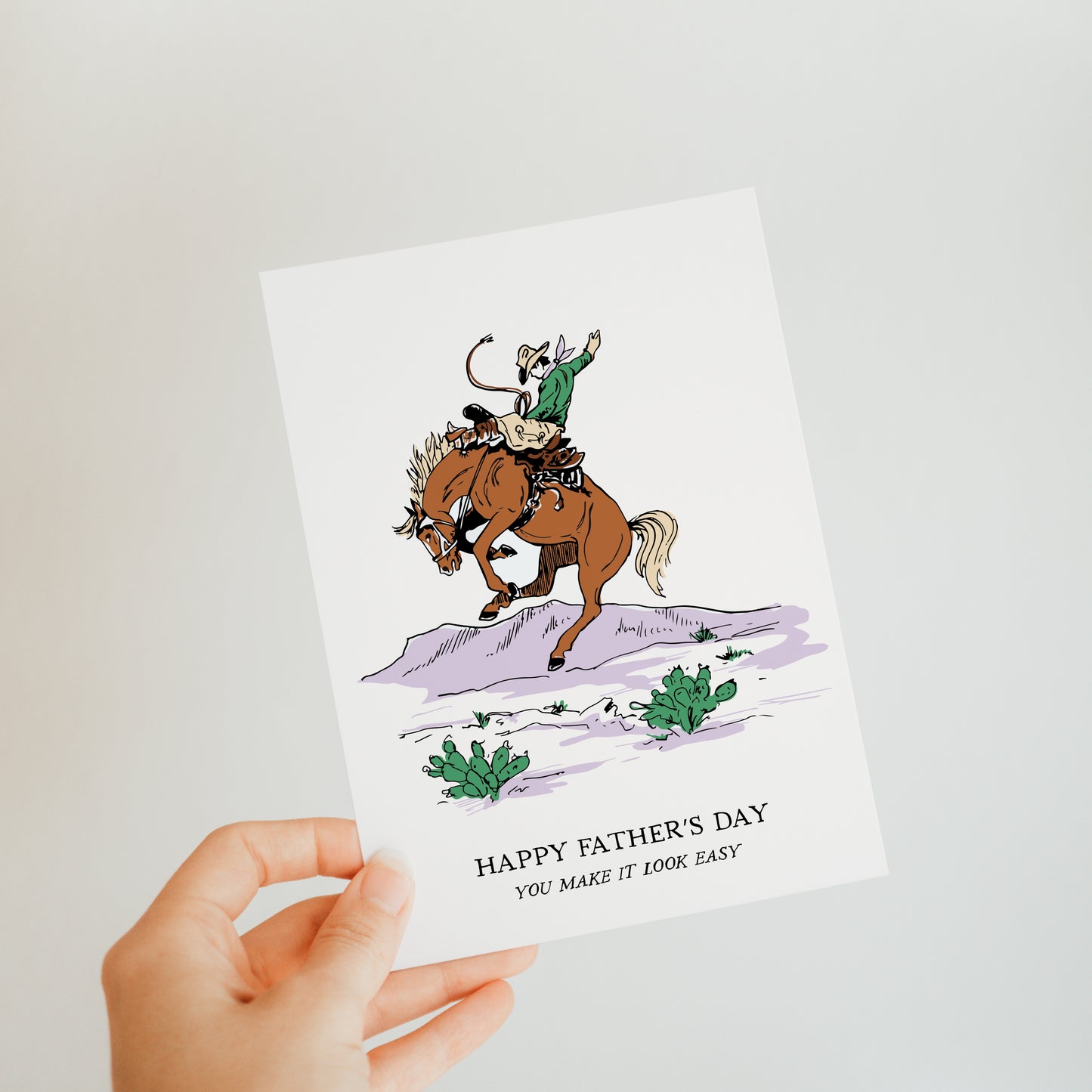 Bucking Bronc Father's Day card with a cowboy on a bucking bronco in a desert. Cowboy and rodeo theme, great for dads who enjoy western traditions