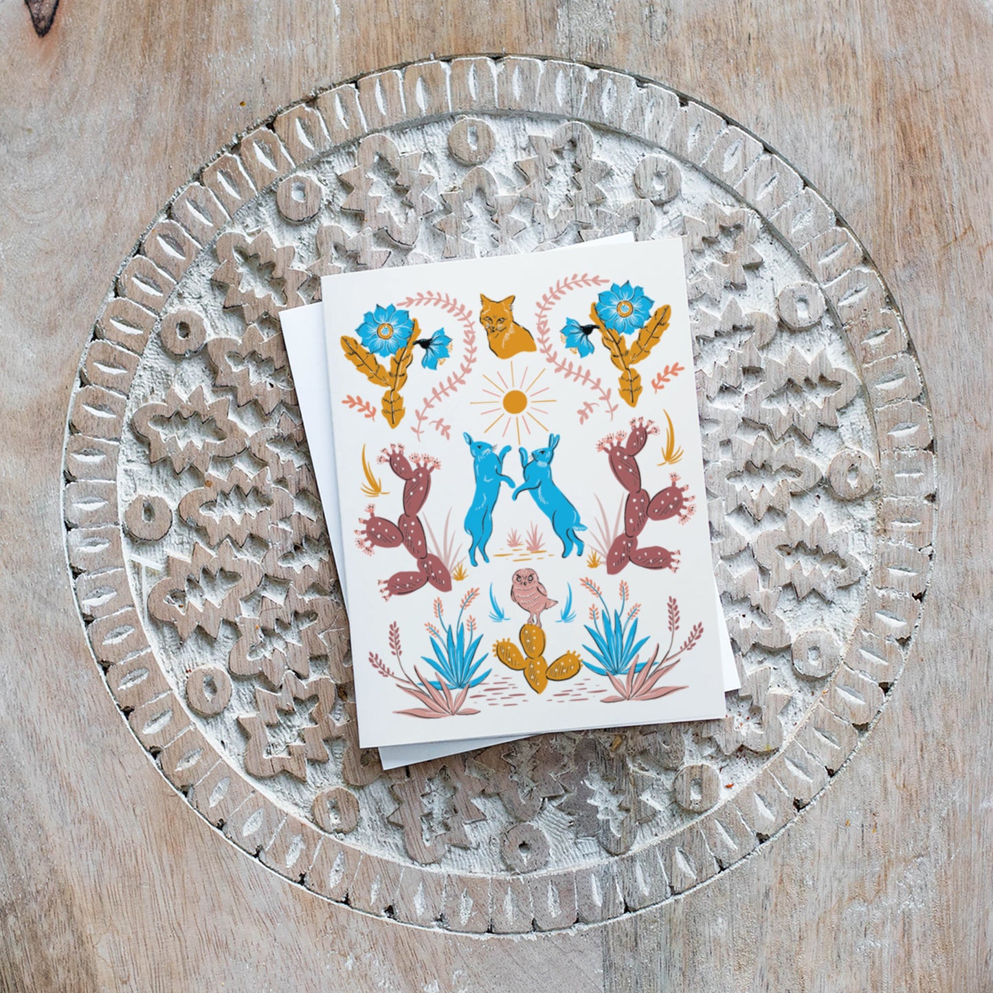 Blank card with desert motifs including cacti and animals, ideal for nature lovers and any occasion.