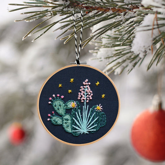 Embroidery Ornament kit with fabric, wooden hoop, thread, needle, and instructions for beginners, featuring desert flora at night