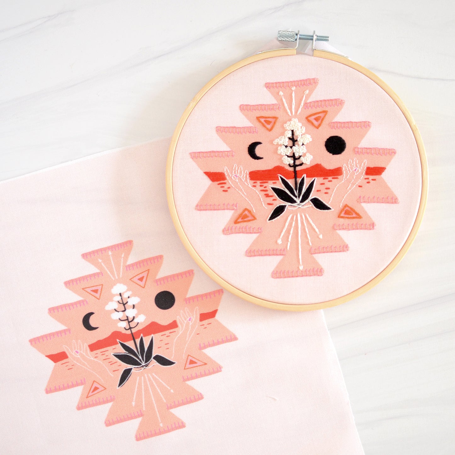 Embroidery kit with fabric, wooden hoop, thread, needle, and instructions for beginners, featuring a geometric desert scene