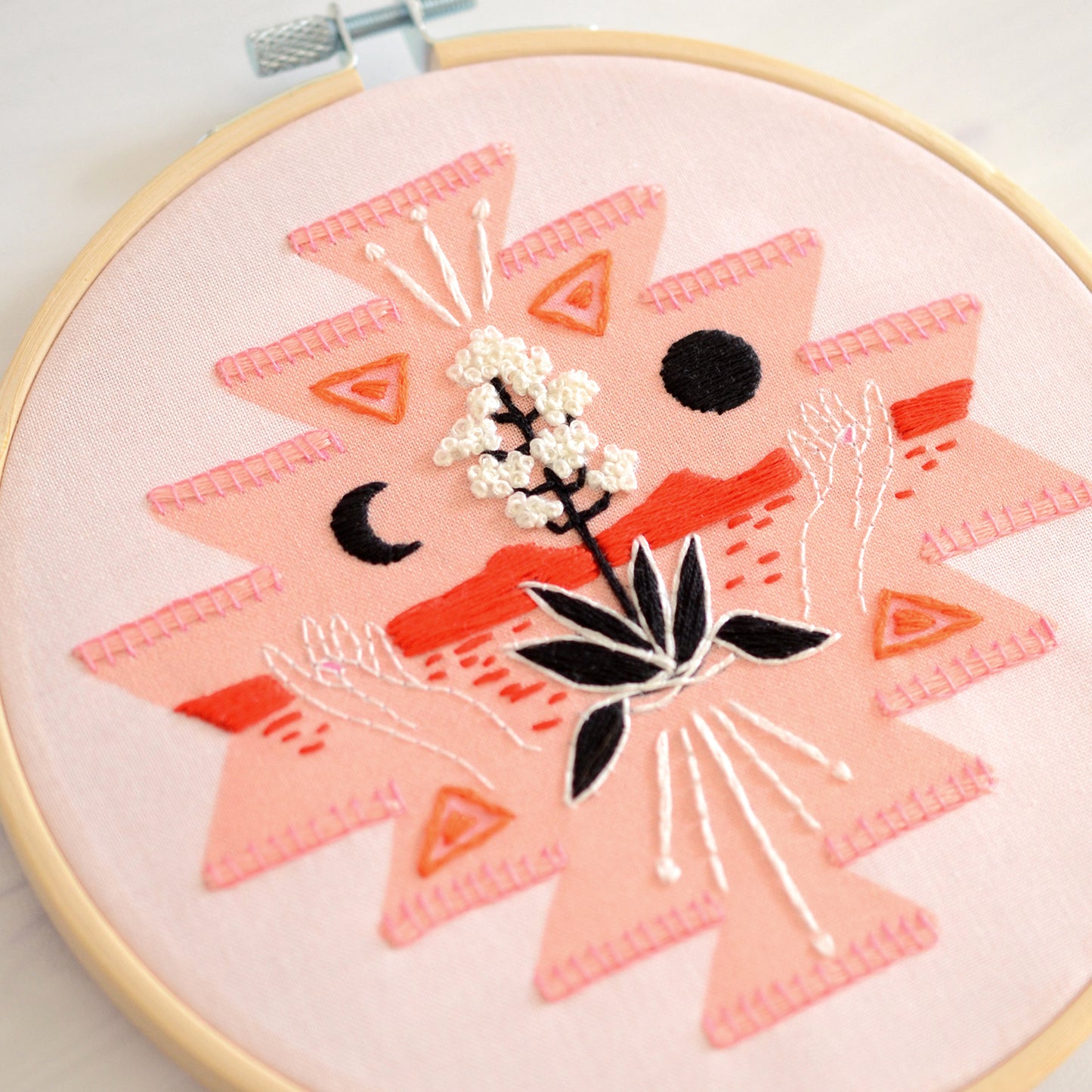 Embroidery kit with fabric, wooden hoop, thread, needle, and instructions for beginners, featuring a geometric desert scene