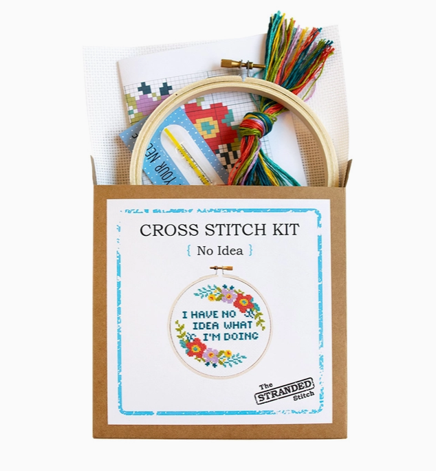 Cross stitch kit with fabric, wooden hoop, thread, needle, and instructions for beginners, saying "I have no idea what I'm doing".