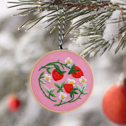 Embroidery Ornament kit with fabric, wooden hoop, thread, needle, and instructions for beginners, featuring cute strawberries and flowers