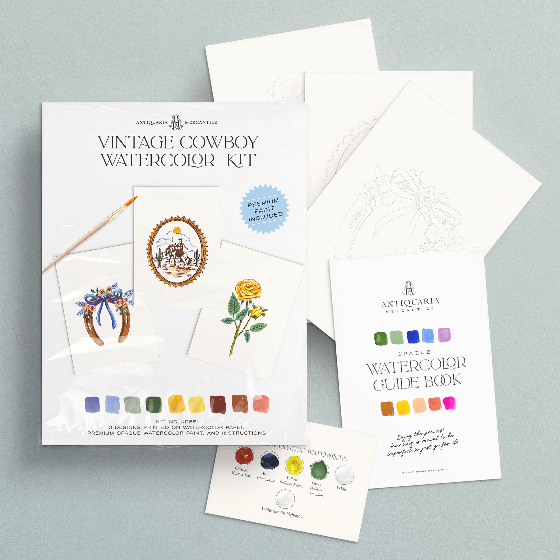 Vintage Cowboy Watercolor Kit with guide book and paint swatches on a gray background