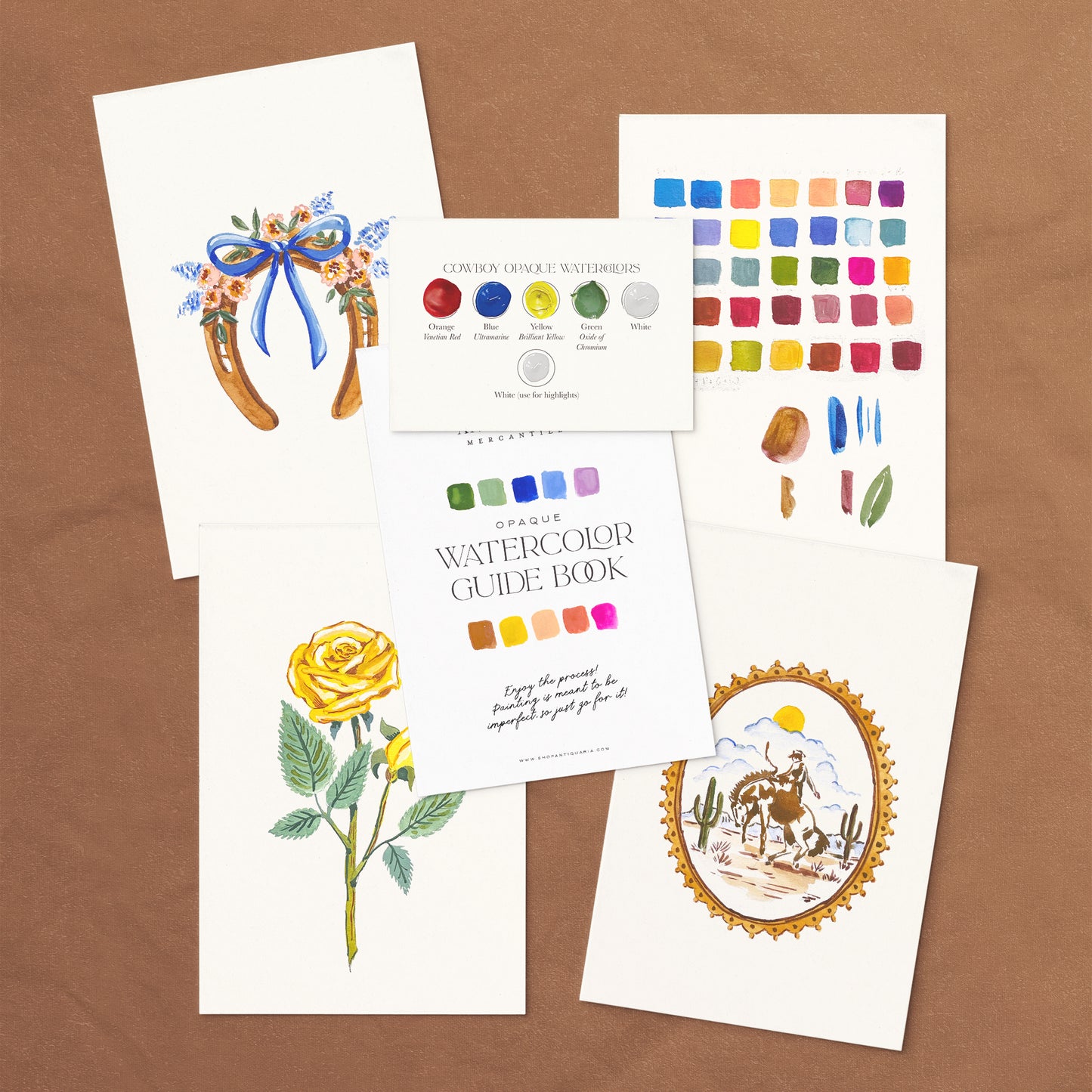 Vintage Cowboy Watercolor Kit with guide book and paint swatches on a gray background